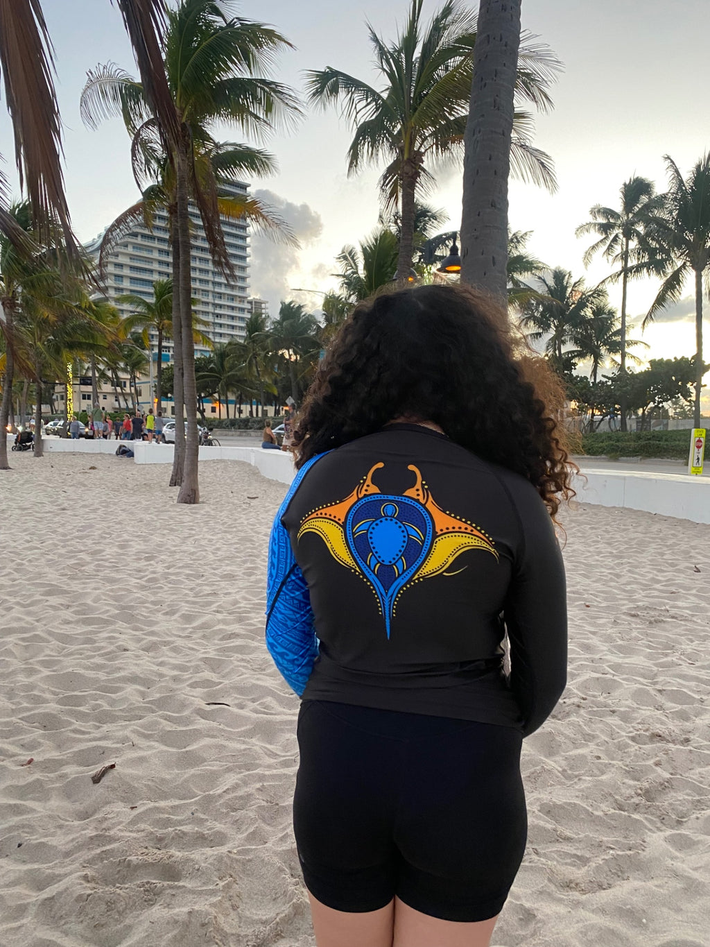 Back view of the ocean blue tribal sleeve rashguard