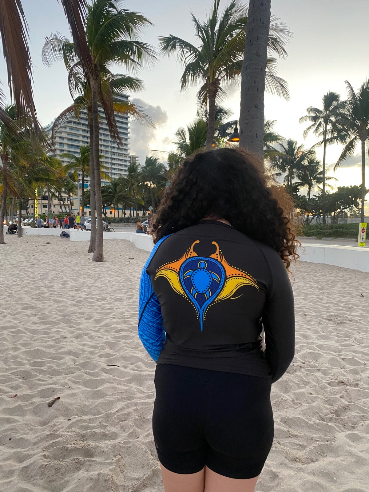 Back view of the ocean blue tribal sleeve rashguard