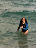 Ocean blue sleeve Maui Beach Adventures rashguard in the surf
